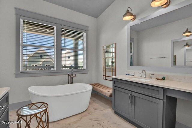 8320 Surf Dr, Panama City Beach, FL 32408 - full bath featuring marble finish floor, a freestanding bath, and vanity