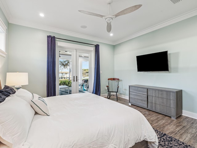 bedroom with baseboards, crown molding, access to exterior, and wood finished floors
