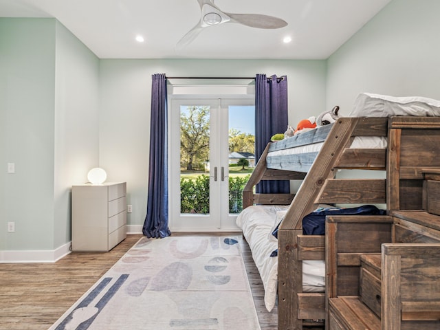 bedroom with baseboards, wood finished floors, recessed lighting, and a ceiling fan