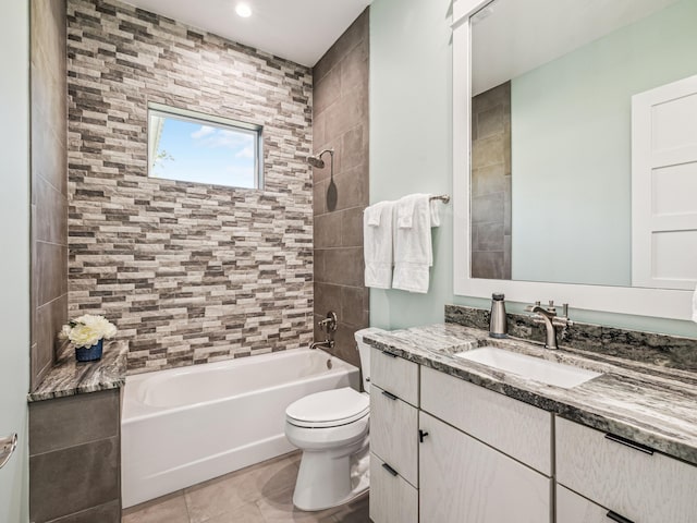 full bathroom featuring shower / washtub combination, toilet, vanity, and tile patterned floors