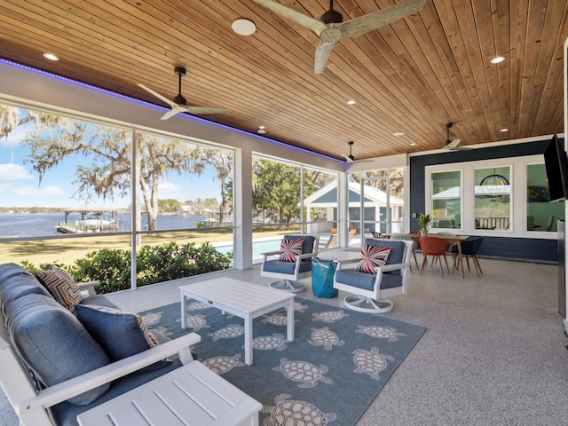 view of patio with outdoor dining area, an outdoor hangout area, a water view, and ceiling fan