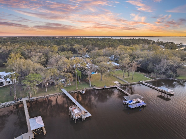 aerial view at dusk with a water view
