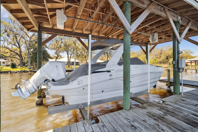 dock area featuring a water view and boat lift