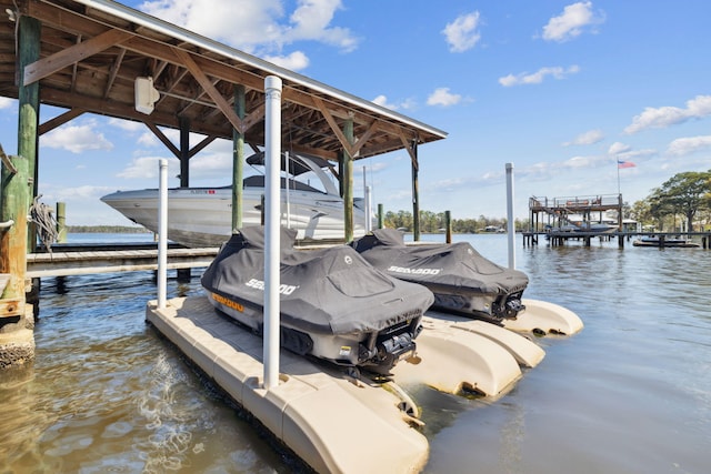 dock area featuring a water view and boat lift