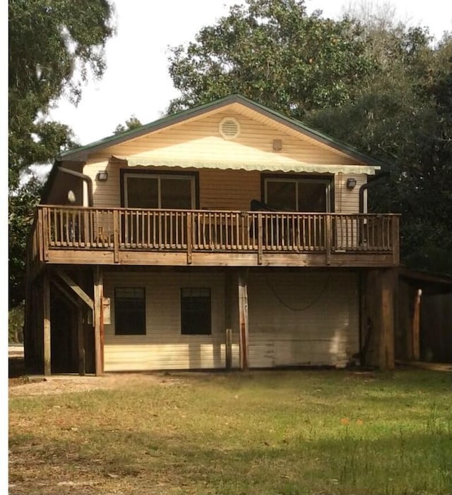 3139 Live Oak St, Navarre, FL 32566 - rear view of property featuring a lawn and a wooden deck