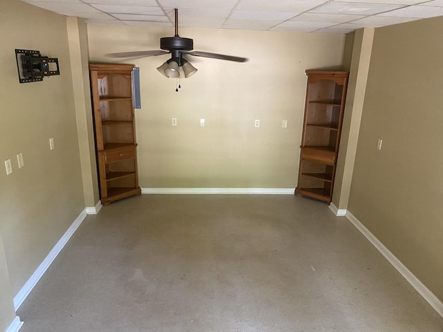 3139 Live Oak St, Navarre, FL 32566 - interior space with baseboards, a ceiling fan, concrete floors, and a drop ceiling