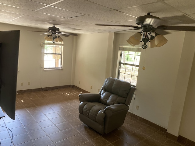 3139 Live Oak St, Navarre, FL 32566 - sitting room with plenty of natural light, a ceiling fan, and dark tile patterned flooring