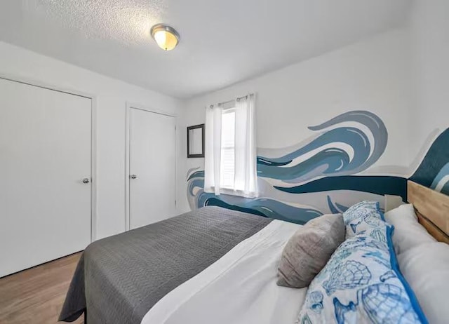 bedroom with wood finished floors