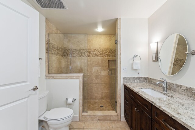1848 E County Highway 30a Unit 4, Santa Rosa Beach, FL 32459 - bathroom featuring vanity, toilet, a shower stall, and tile patterned floors