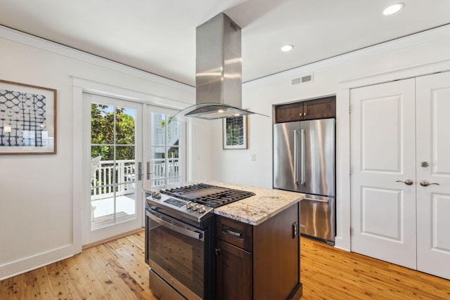 1848 E County Highway 30a Unit 4, Santa Rosa Beach, FL 32459 - kitchen featuring appliances with stainless steel finishes, island range hood, dark brown cabinetry, light wood-style floors, and recessed lighting