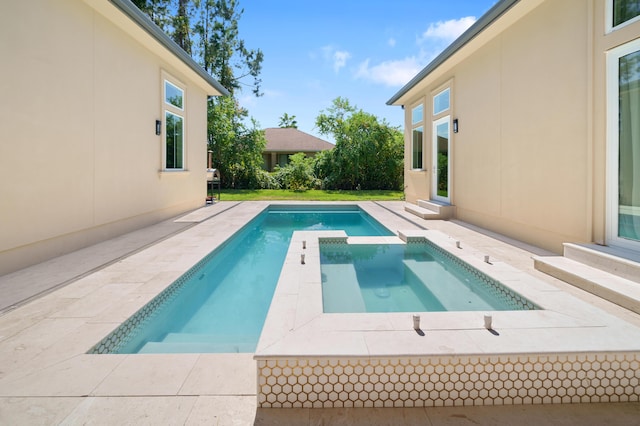 view of pool with entry steps, a patio, and a pool with connected hot tub