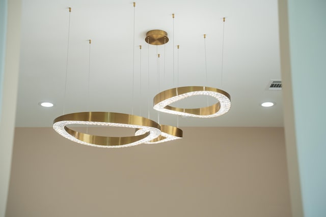 room details with visible vents and recessed lighting