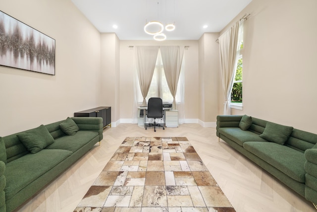 living area with baseboards and recessed lighting