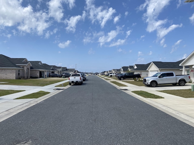 3784 Redbud Way, Panama City, FL 32404 - view of road featuring sidewalks, a residential view, and street lighting