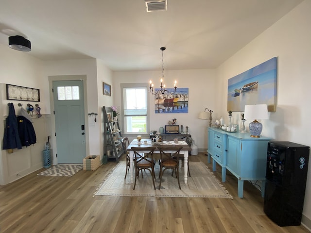 3784 Redbud Way, Panama City, FL 32404 - dining space featuring visible vents, wood finished floors, and a chandelier