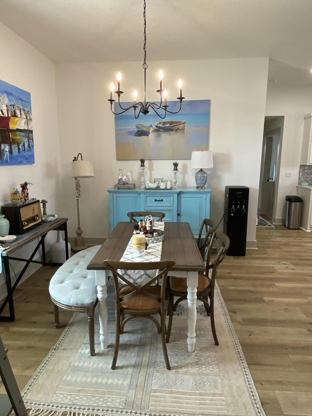 3784 Redbud Way, Panama City, FL 32404 - dining area with a chandelier and light wood-type flooring