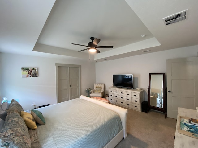 3784 Redbud Way, Panama City, FL 32404 - bedroom with a tray ceiling, visible vents, a ceiling fan, and light carpet