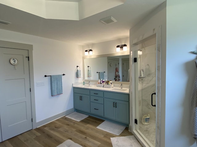 3784 Redbud Way, Panama City, FL 32404 - bathroom featuring a sink, a shower stall, and wood finished floors