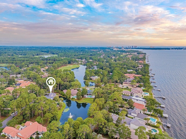 aerial view at dusk with a water view