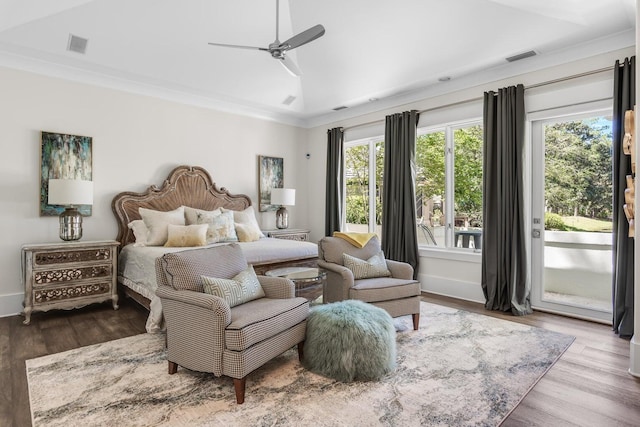 bedroom with visible vents, access to outside, lofted ceiling, and wood finished floors