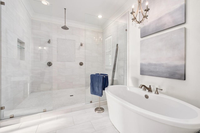 full bath featuring tile patterned floors, a freestanding tub, a stall shower, and crown molding
