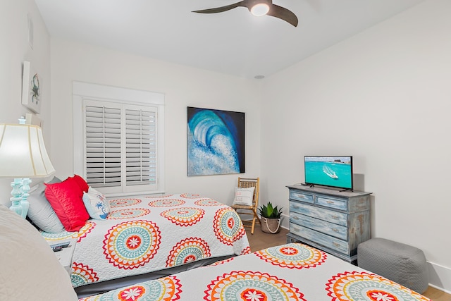 bedroom featuring ceiling fan and wood finished floors