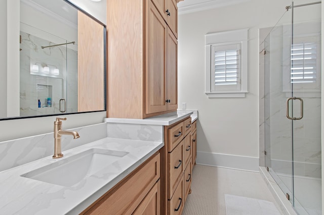full bath with a shower stall, baseboards, ornamental molding, tile patterned floors, and vanity