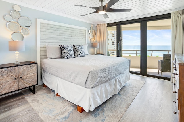 291 Scenic Gulf Dr Unit 1405, Miramar Beach, FL 32550 - bedroom featuring wood ceiling, access to outside, light wood-style flooring, and expansive windows