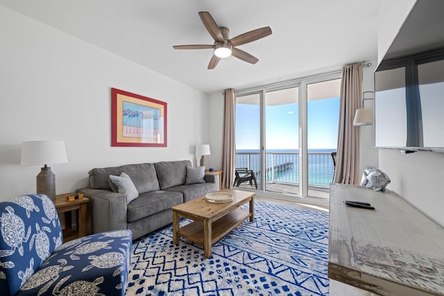 8575 Gulf Blvd Unit 1402, Navarre, FL 32566 - living area with floor to ceiling windows and a ceiling fan