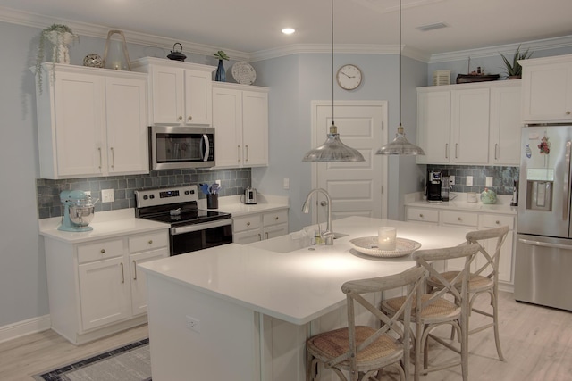 148 Piper Cv, Santa Rosa Beach, FL 32459 - kitchen featuring white cabinets, stainless steel appliances, a sink, decorative backsplash, and light countertops