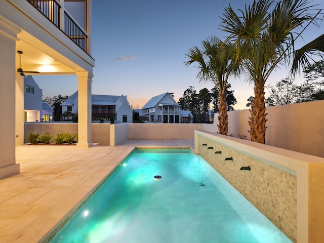 267 Tyler Dr, Santa Rosa Beach, FL 32459 - pool at dusk with a fenced backyard and a patio area