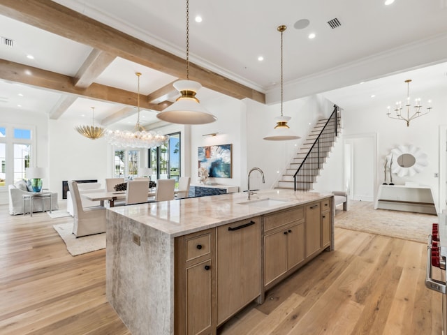267 Tyler Dr, Santa Rosa Beach, FL 32459 - kitchen featuring light wood finished floors, visible vents, a sink, and an inviting chandelier