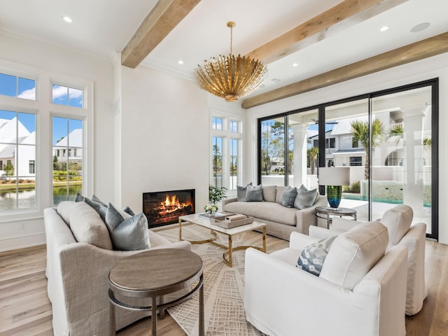 267 Tyler Dr, Santa Rosa Beach, FL 32459 - living area featuring crown molding, a glass covered fireplace, light wood-type flooring, beamed ceiling, and recessed lighting