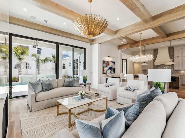 267 Tyler Dr, Santa Rosa Beach, FL 32459 - living room with a notable chandelier, beam ceiling, visible vents, light wood-style floors, and recessed lighting