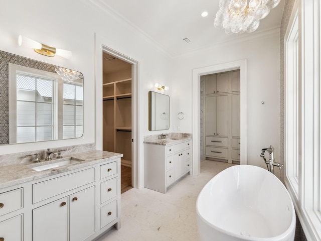 267 Tyler Dr, Santa Rosa Beach, FL 32459 - full bath with crown molding, a soaking tub, a sink, a notable chandelier, and two vanities