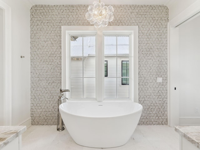 267 Tyler Dr, Santa Rosa Beach, FL 32459 - bathroom with vanity, a freestanding tub, and a notable chandelier