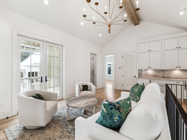267 Tyler Dr, Santa Rosa Beach, FL 32459 - living room with high vaulted ceiling, baseboards, beam ceiling, light wood-type flooring, and a notable chandelier
