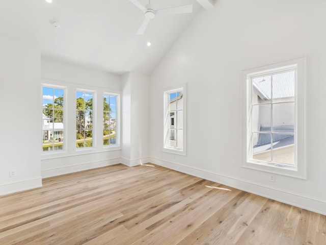 267 Tyler Dr, Santa Rosa Beach, FL 32459 - unfurnished room with baseboards, high vaulted ceiling, light wood-style floors, and ceiling fan