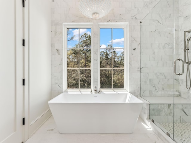 267 Tyler Dr, Santa Rosa Beach, FL 32459 - bathroom featuring a soaking tub, a wealth of natural light, and a marble finish shower