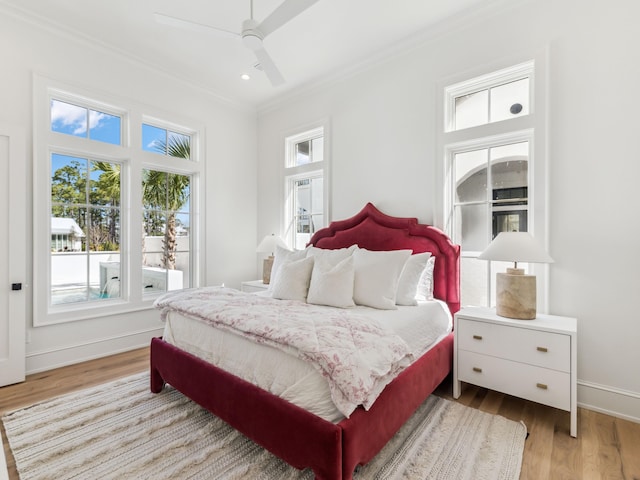 267 Tyler Dr, Santa Rosa Beach, FL 32459 - bedroom featuring baseboards, crown molding, wood finished floors, and ceiling fan