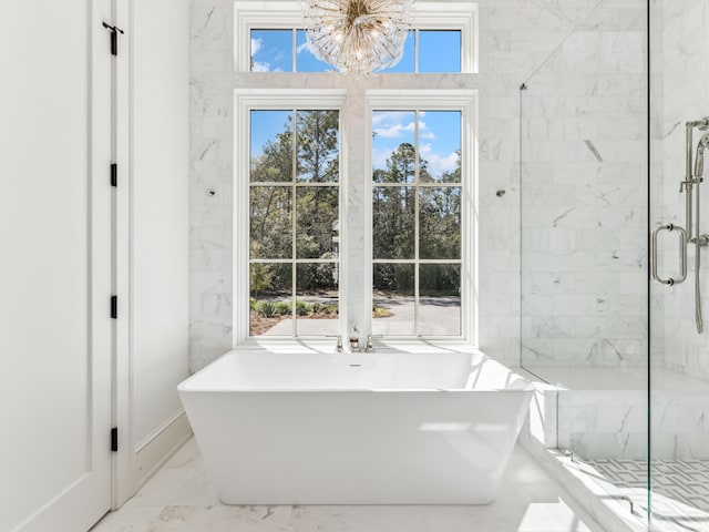 267 Tyler Dr, Santa Rosa Beach, FL 32459 - full bathroom featuring marble finish floor, a stall shower, a chandelier, and a freestanding bath
