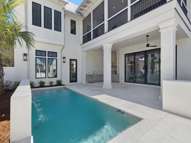 267 Tyler Dr, Santa Rosa Beach, FL 32459 - outdoor pool with french doors, an outdoor kitchen, ceiling fan, and a patio area