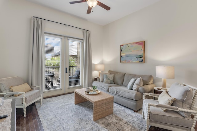 living room featuring a ceiling fan and hardwood / wood-style flooring