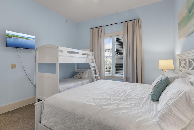 bedroom featuring baseboards and carpet floors
