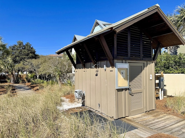 view of property exterior featuring an outbuilding