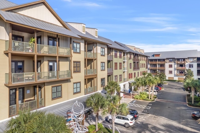 view of property with uncovered parking