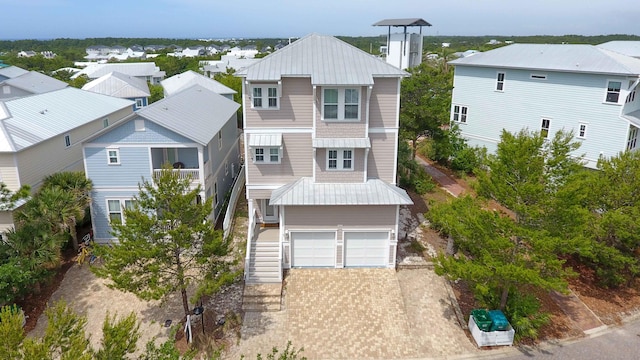 294 Gulfview Cir, Santa Rosa Beach, FL 32459 - view of front facade featuring stairway, a residential view, driveway, and an attached garage