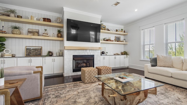 294 Gulfview Cir, Santa Rosa Beach, FL 32459 - living area featuring baseboards, visible vents, a tile fireplace, dark wood-type flooring, and crown molding