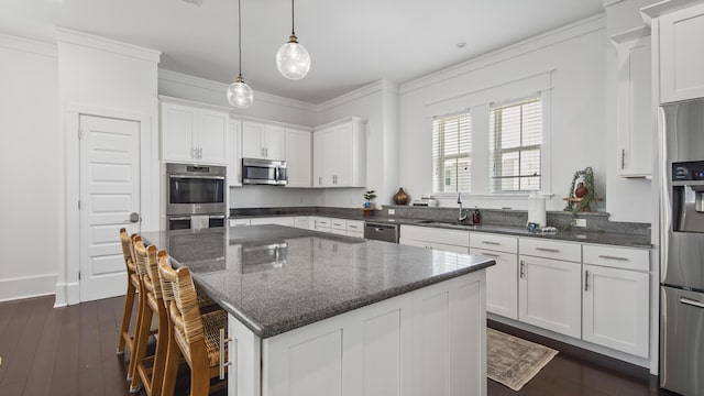 294 Gulfview Cir, Santa Rosa Beach, FL 32459 - kitchen with a sink, dark wood finished floors, dark stone counters, appliances with stainless steel finishes, and white cabinets