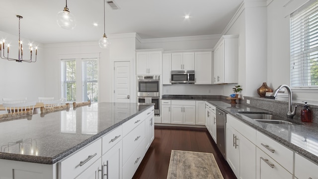 294 Gulfview Cir, Santa Rosa Beach, FL 32459 - kitchen featuring visible vents, a sink, dark wood-type flooring, appliances with stainless steel finishes, and a notable chandelier